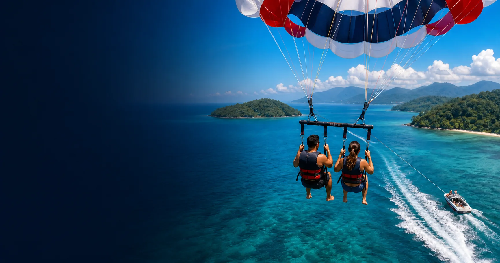 Parasailing above clear blue water near Kota Kinabalu